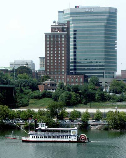 Picture of the Star of Knoxville paddle wheeler riverboat cruising the Tennessee River with skyline in background