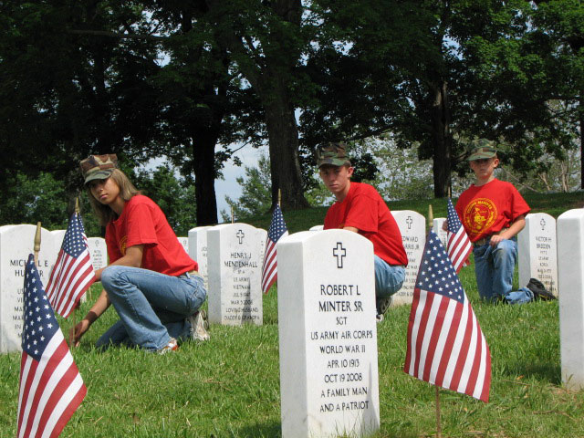 Members of Knoxville's Young Marines Plant US Flags on the graves at the Tennessee Veterans Cemetery
